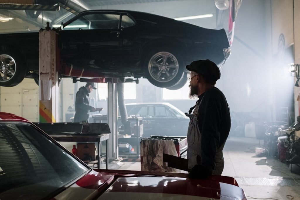 Free Man in Black Jacket Standing Beside Car Stock Photo